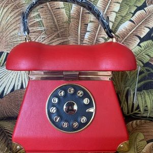 Super cute and brand new! Red telephone crossbody
